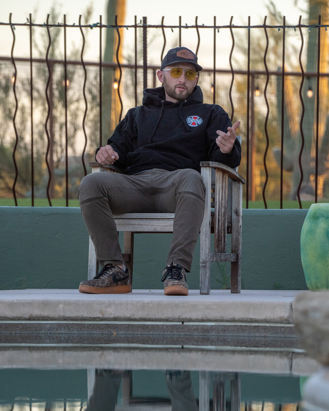 Man sitting outdoors in the Carry Belt Hood
