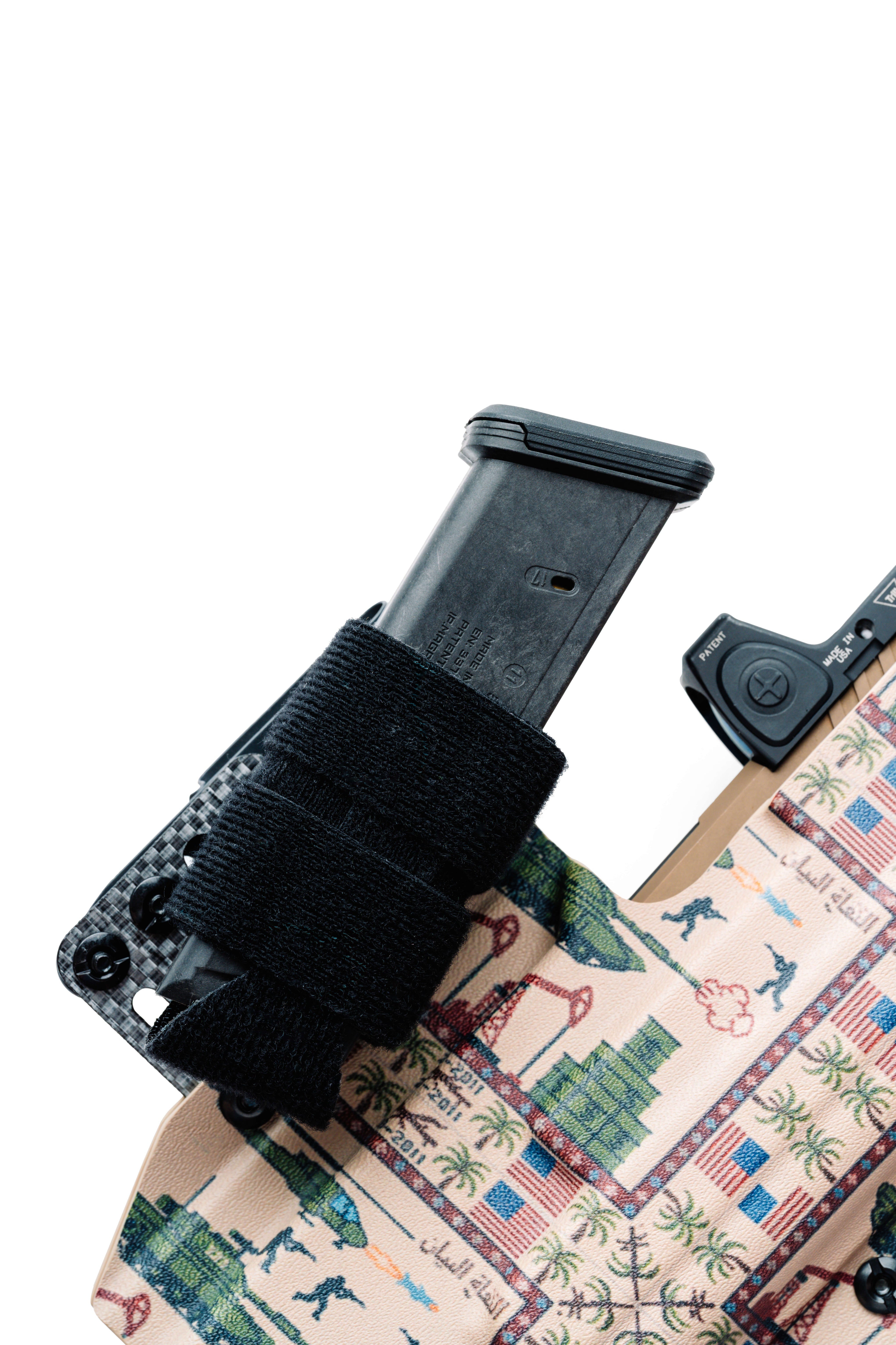 Black magazine holder attached to a tactical pouch with a colorful design on a white background