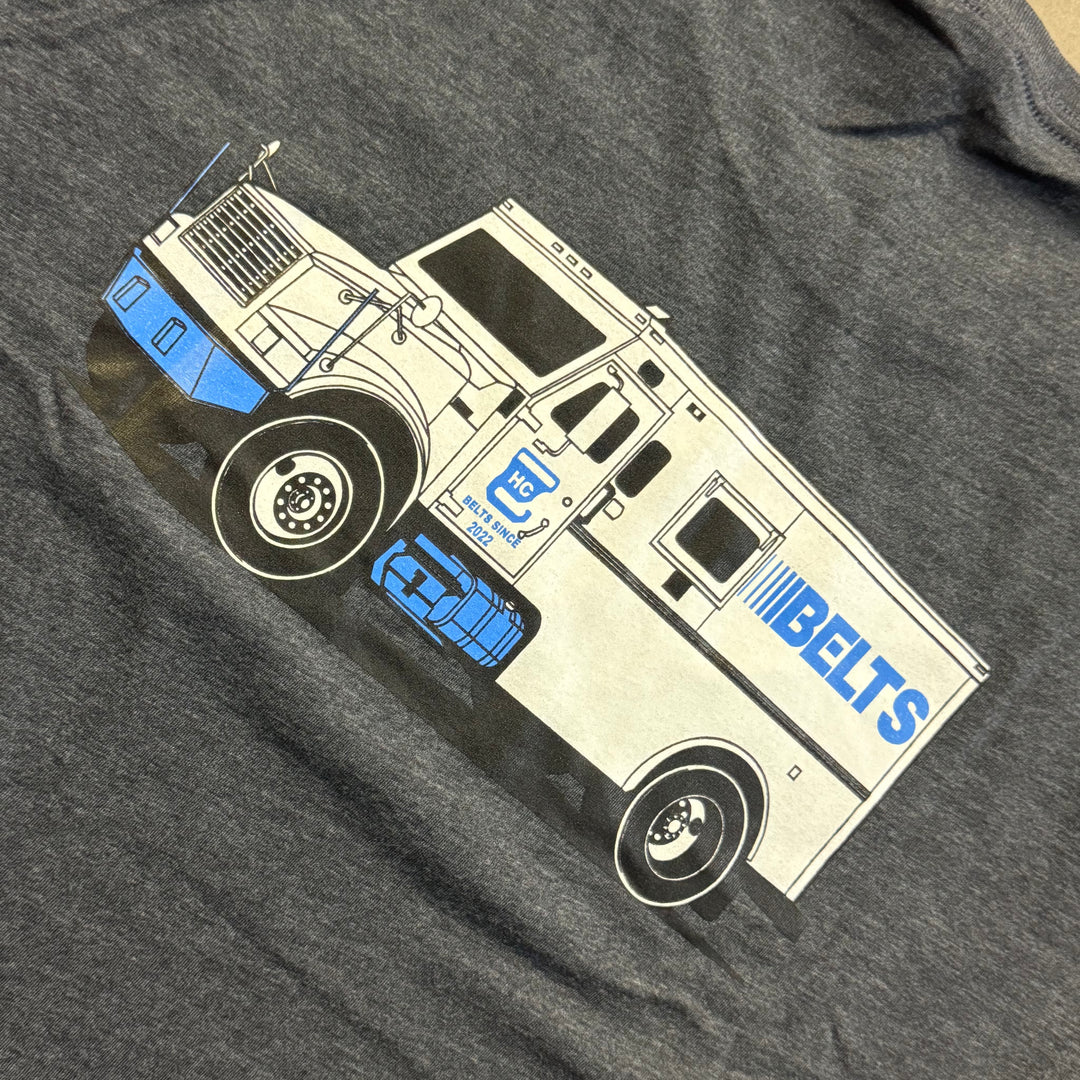 Gray t-shirt with a graphic of a truck and 'BELTS' branding on a dark gray background