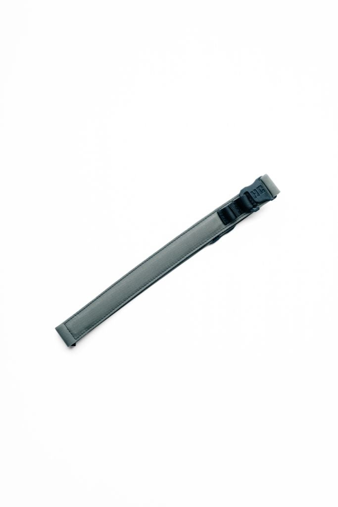 Green AYCHE Constantine Carry Belt™ for apparel, featuring a durable design and adjustable fit, shown on a model.
