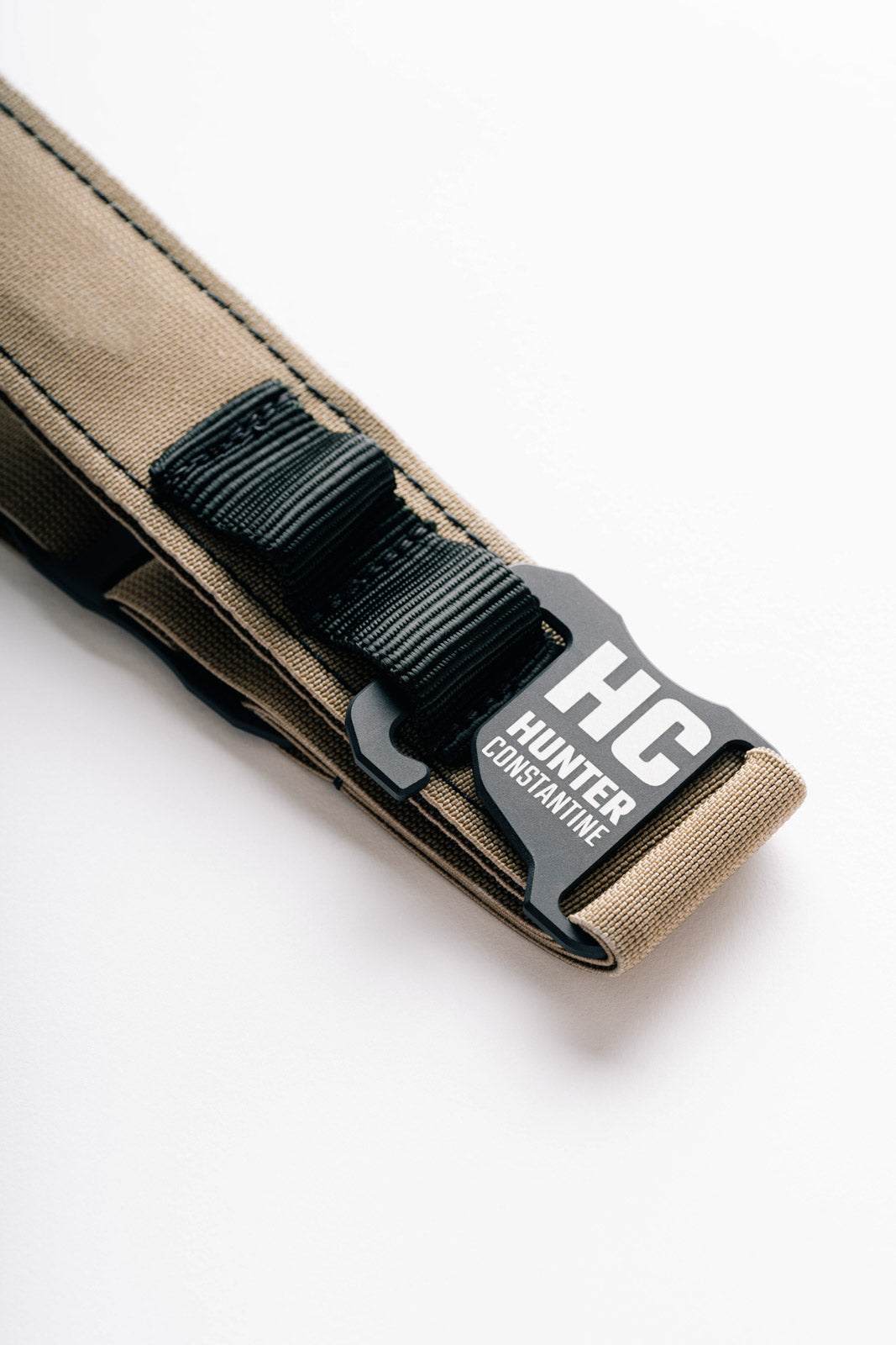 AYCHE Constantine Carry Belt™ in dark leather with adjustable strap and metal buckle, designed for versatile everyday wear.