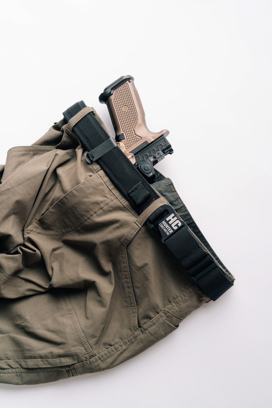 AYCHE Constantine Carry Belt™ in black, durable apparel belt with adjustable strap and metal buckle, styled for casual wear.