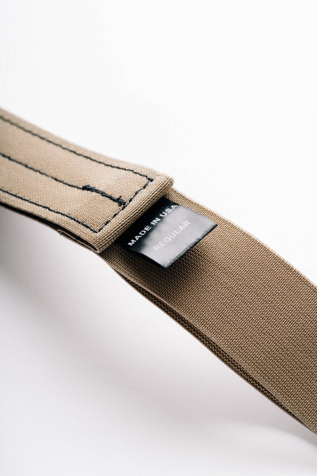 AYCHE Constantine Carry Belt worn with casual apparel, featuring durable leather and adjustable buckle for a stylish, functional accessory.