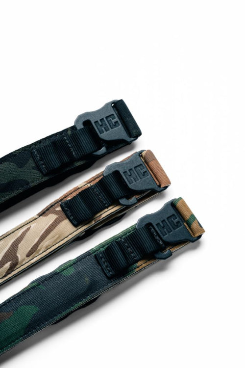 AYCHE CAMO CONSTANTINE CARRY BELT™ in camouflage fabric, featuring adjustable strap and metal buckle for versatile apparel styling.