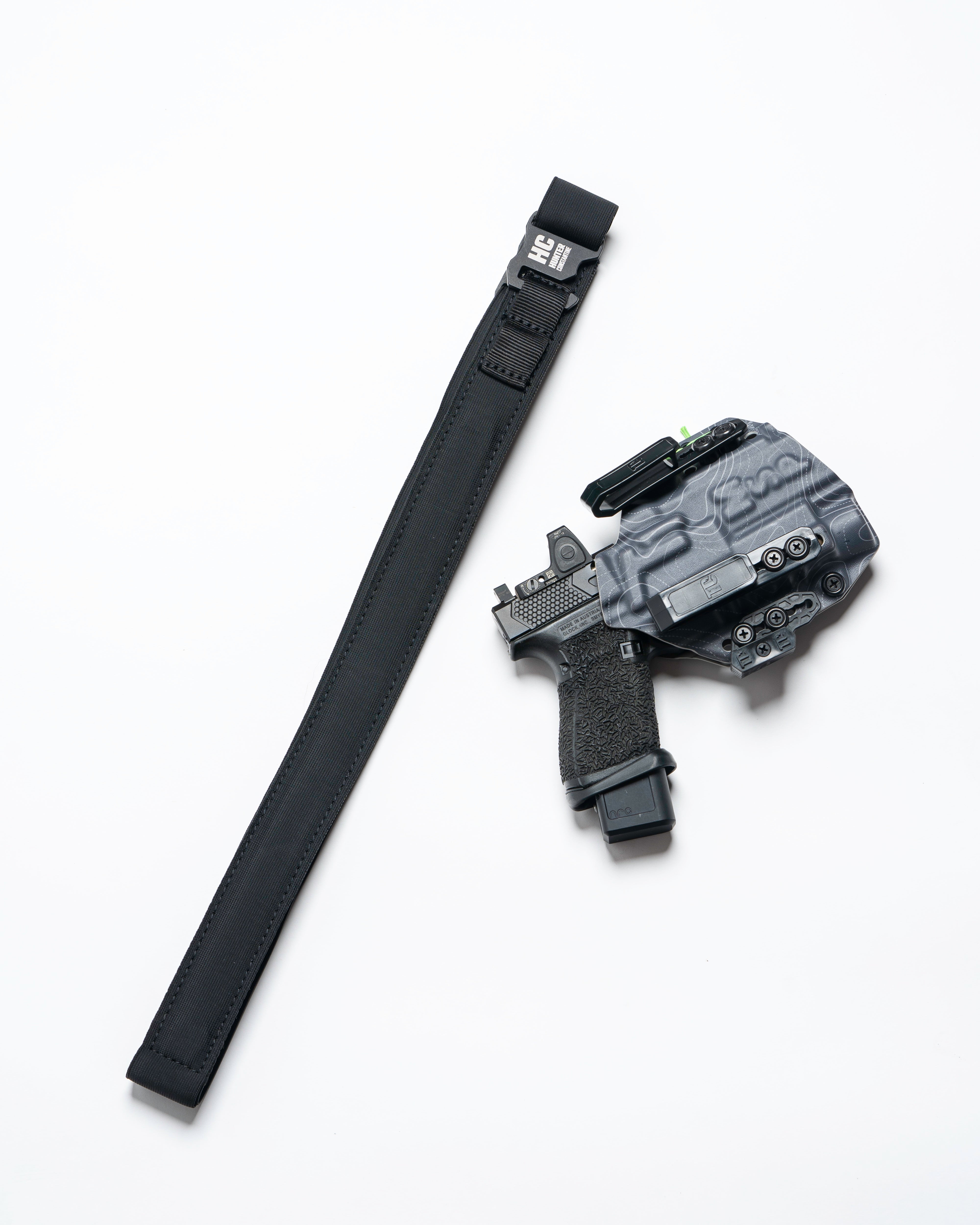 Black AYCHE BLEM Constantine Carry Belt™ worn around waist, showcasing durable apparel belt with adjustable strap and metal buckle.