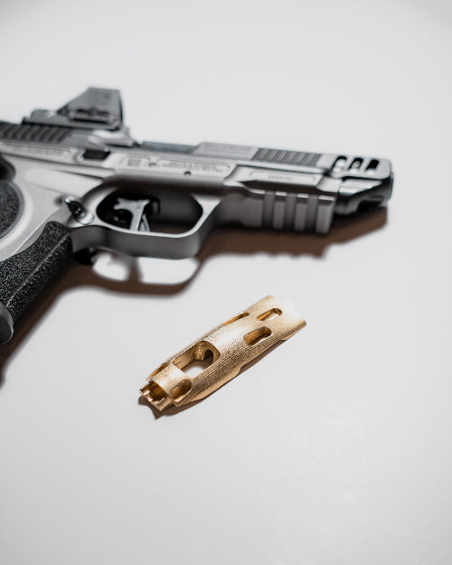 Hunter Constantine Blem S&W M&P9 metal brass grip panel for firearm customization, showcasing textured brass surface and ergonomic design.
