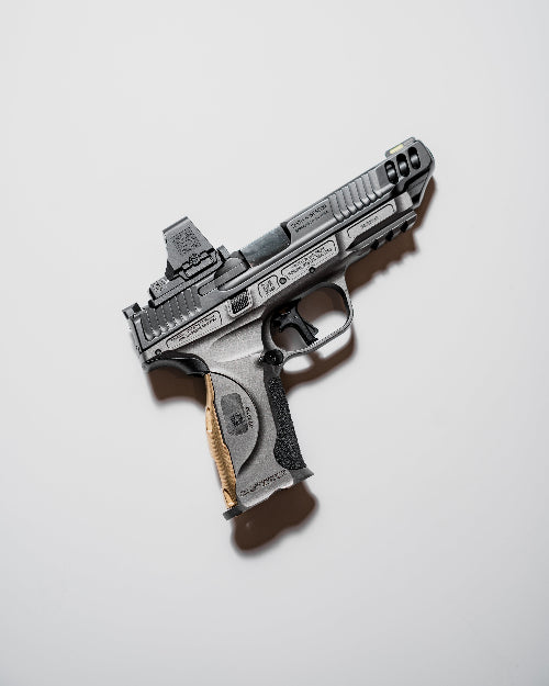 AYCHE Blem S&W M&P9 metal brass grip panel showing textured surface and mounting holes for firearm hardware customization.