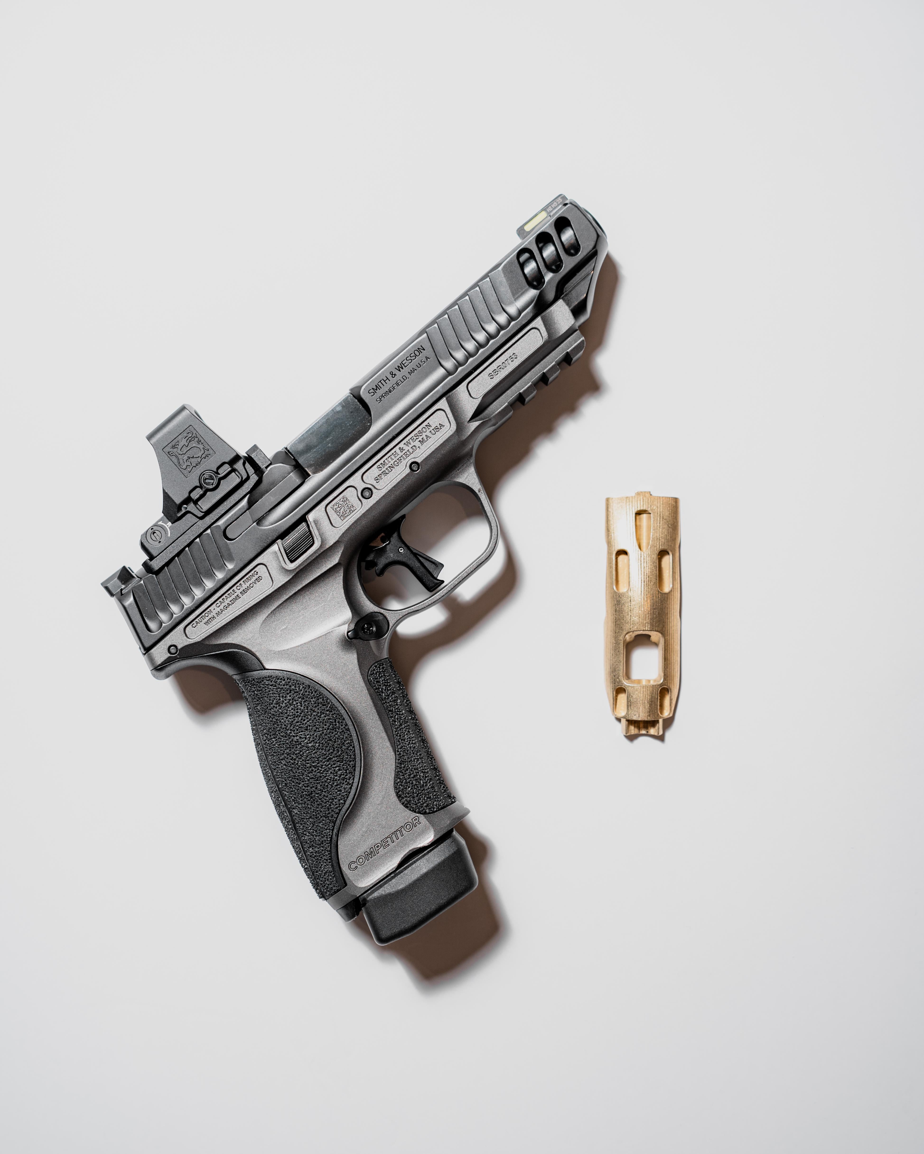 Metal brass grip panel for S&W M&P9 handgun, designed for enhanced grip and durability by Hunter Constantine.