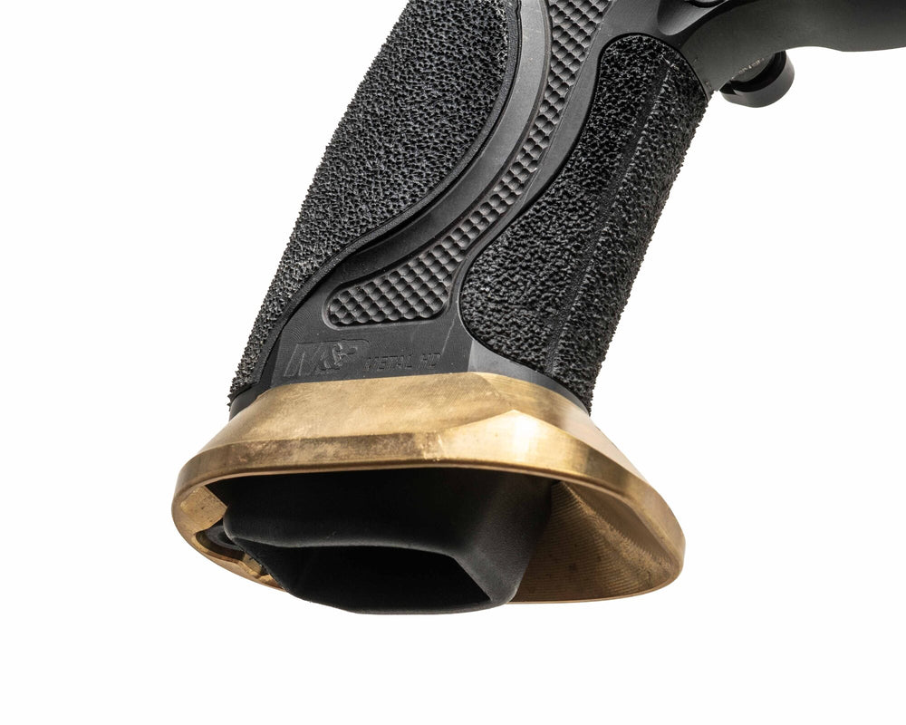 Close view of the brass magwell installed on a full-size metal-frame M&P pistol