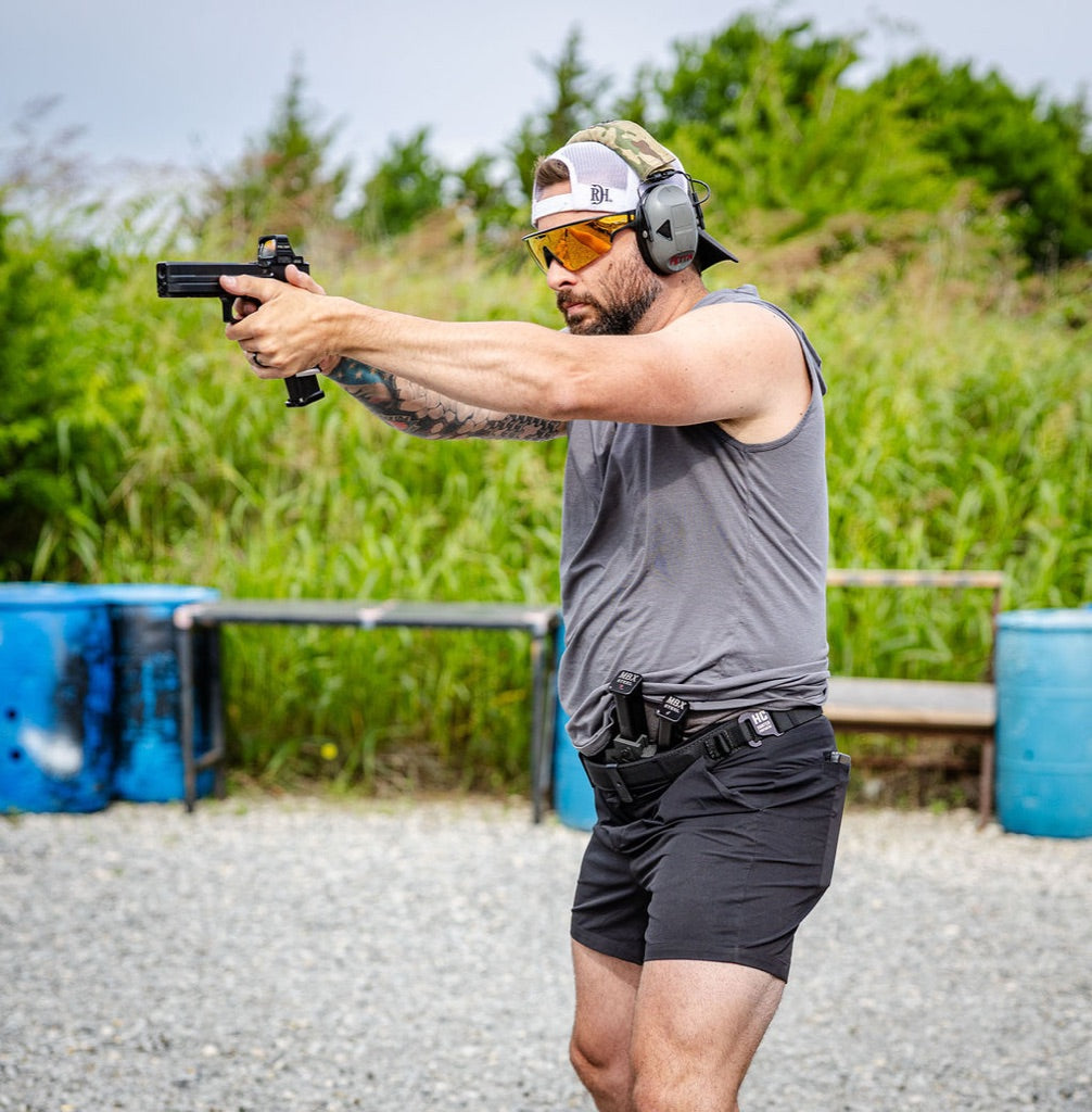 Shooter on the range wearing the Constantine Carry Belt with shorts